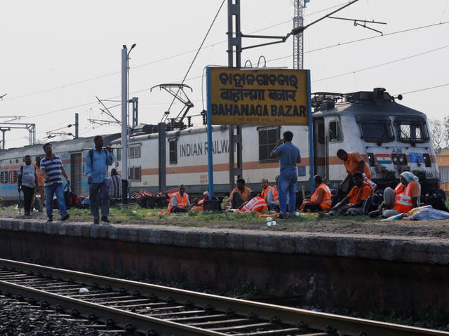 <p>A train arrives at Bahanaga Bazar railway station, near the site of a train collision</p>