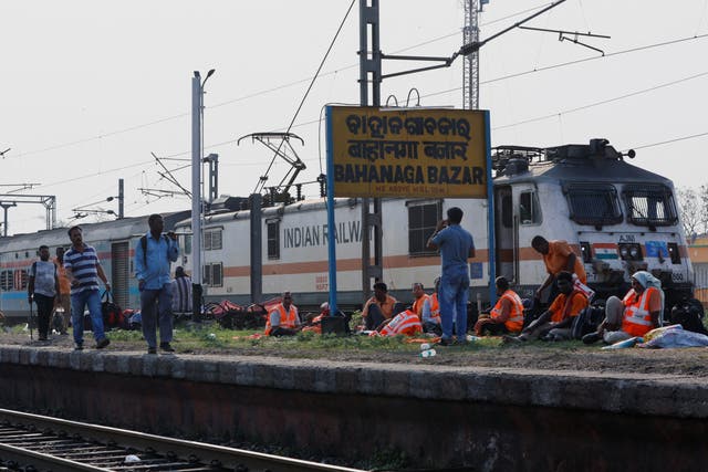 <p>A train arrives at Bahanaga Bazar railway station, near the site of a train collision</p>