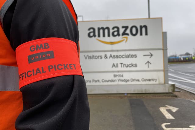 Members of the GMB union on the picket line outside the Amazon centre in Coventry (Phil Barnett/PA)