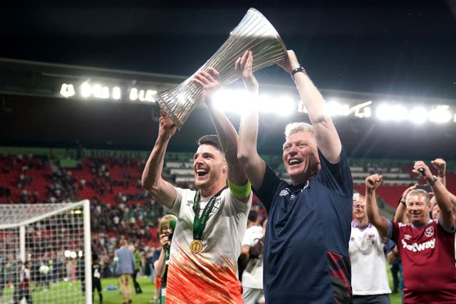 Declan Rice (left) and manager David Moyes lift the Europa Conference League trophy (Tim Goode/PA)