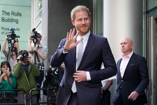 <p>Prince Harry leaves the High Court after giving evidence in London</p>