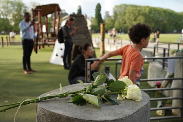 <p>Roses lay at the playground after a knife attack in Annecy, French Alps (Laurent Cipriani/AP)</p>