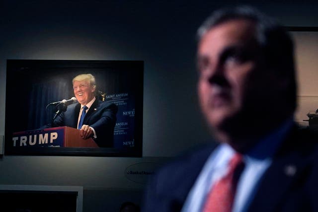 <p>An image of Donald Trump in the background of Chris Christie </p>