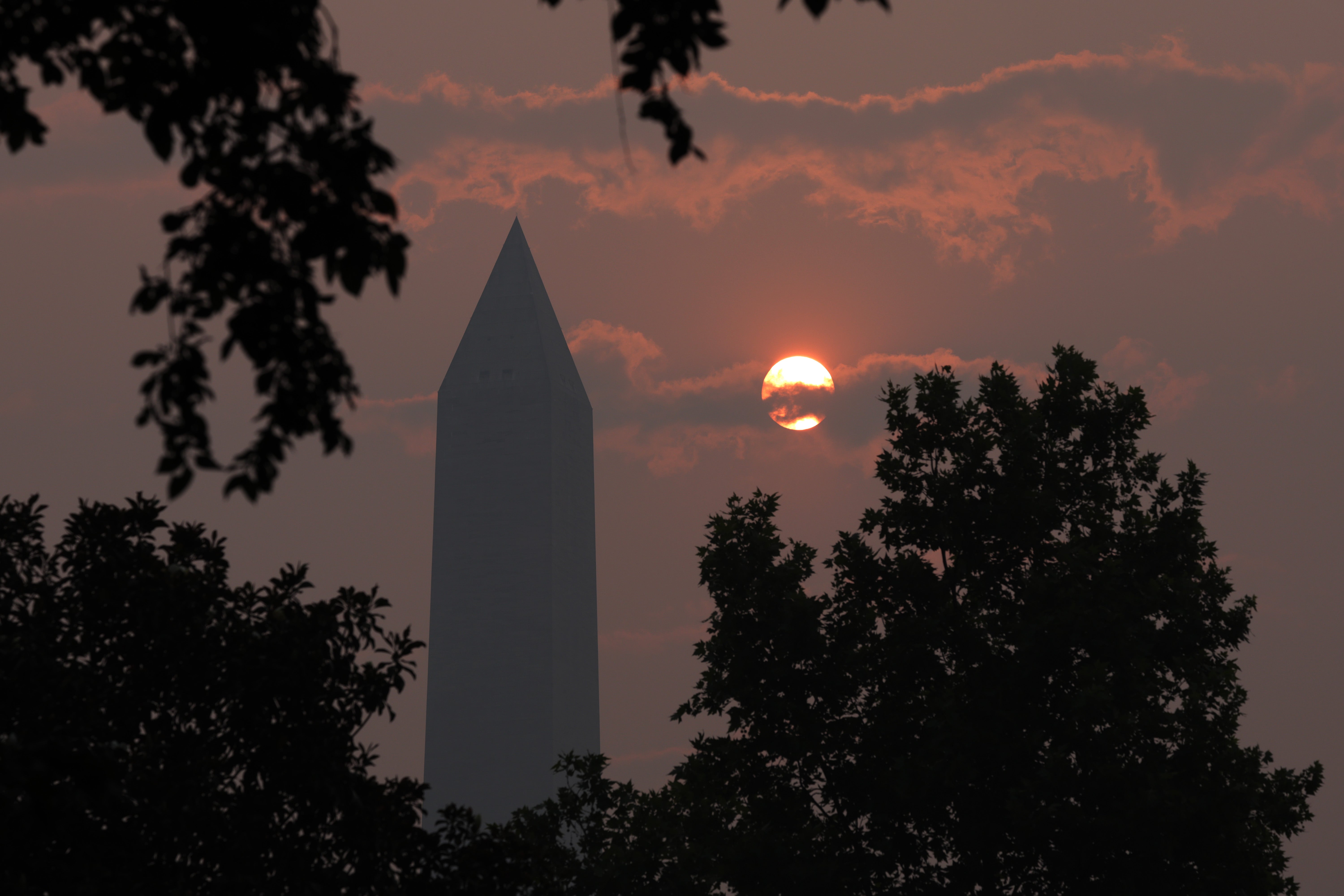 The Washington Memorial stands in hazy smoke on June 8, 2023 in DC after the capital was put under a “code purple” alert for air pollution