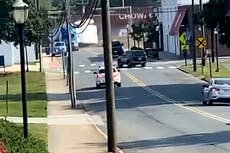 Moment train ploughs through lorry stuck on tracks in North Carolina