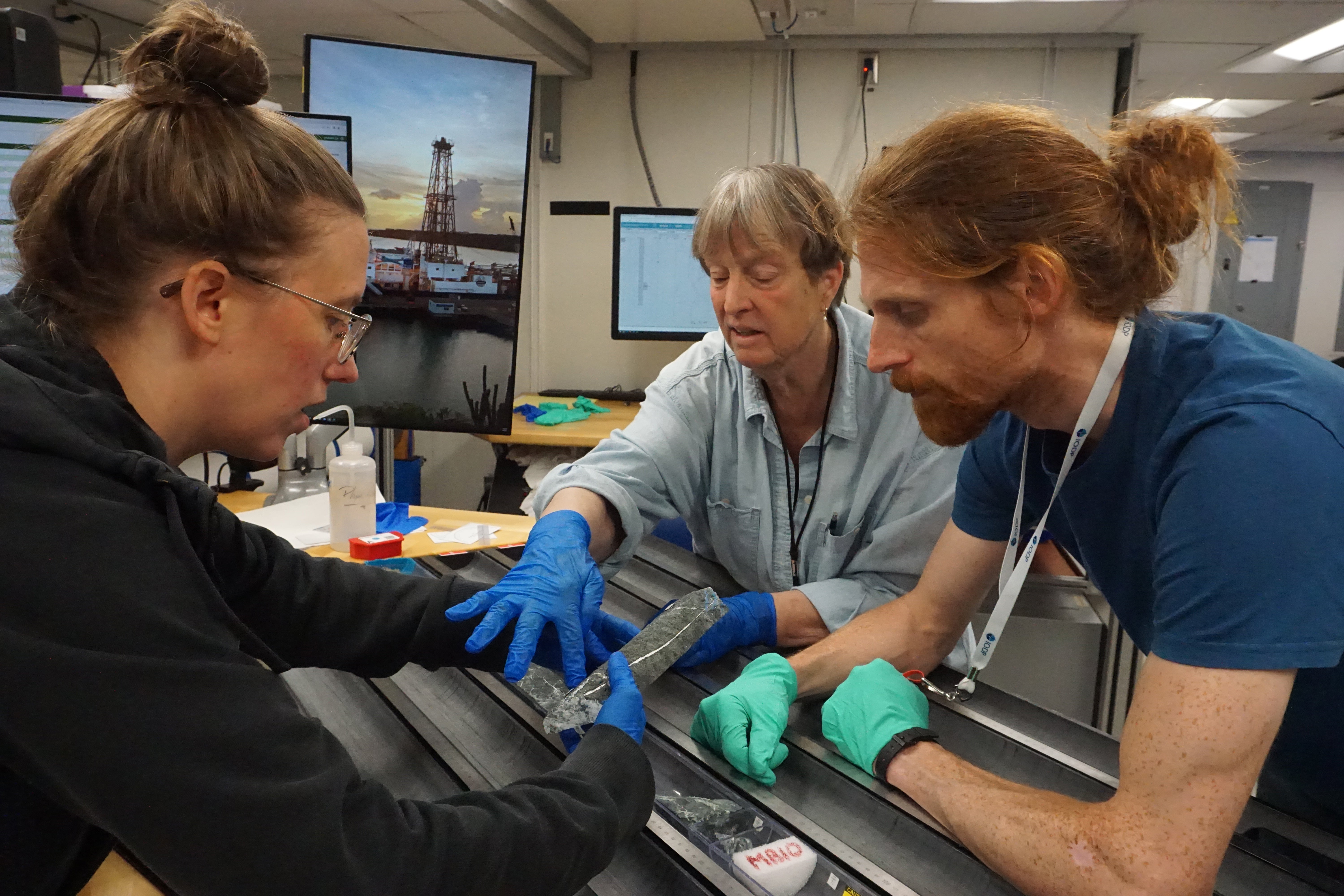 From left, Rebecca Kuehn of Halle University, Barbara John of the University of Wyoming and Andrew Parsons of the University of Plymouth discuss the structural properties of the core samples