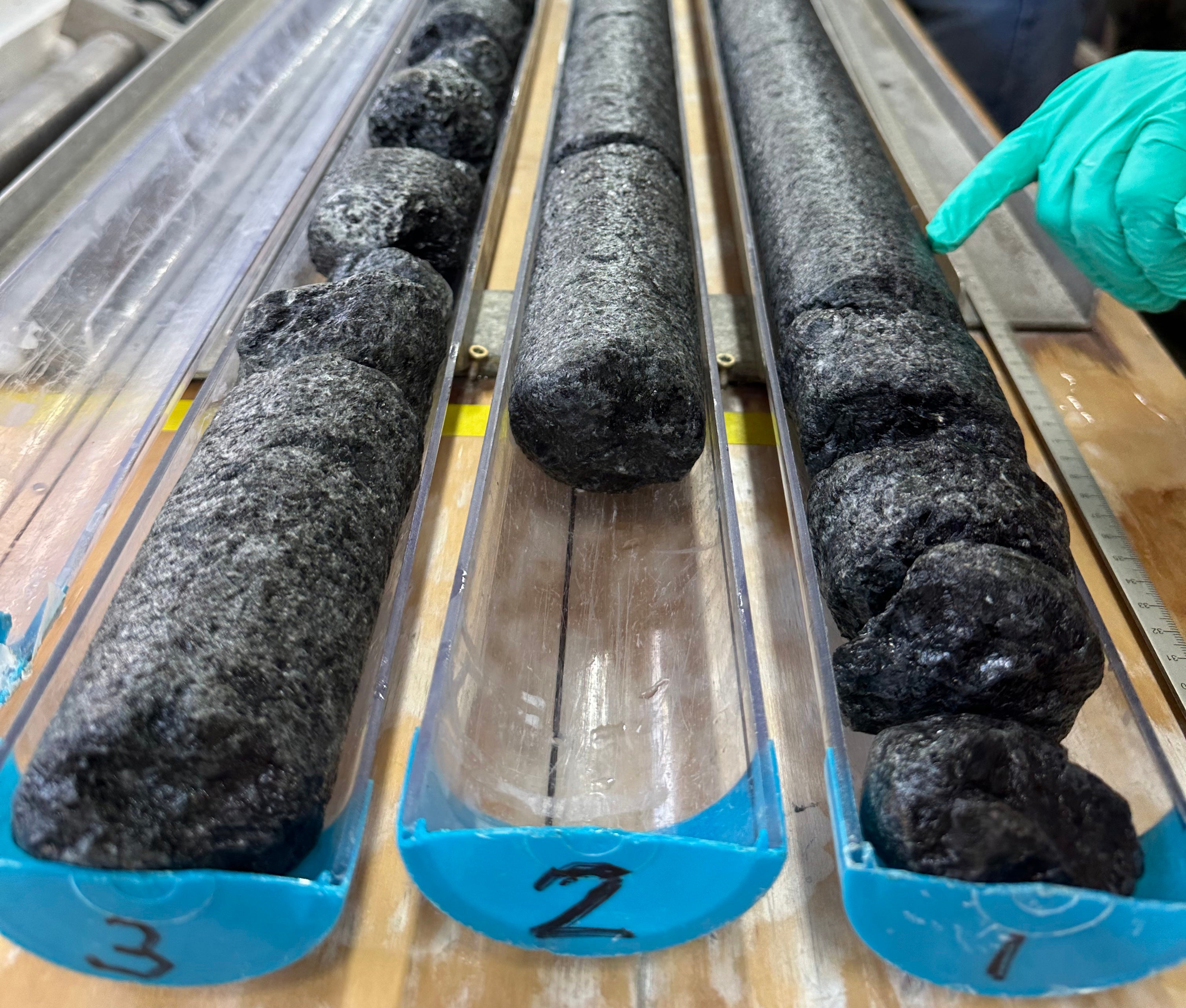 Aboard the Joides Resolution research vessel, team members process samples of mantle rock recovered from a more than 4,100ft-deep hole drilled into the seabed of the North Atlantic