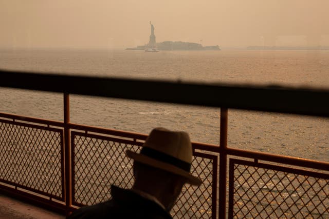 <p>The Statue of Liberty, under a haze-filled sky, is photographed from the Staten Island Ferry, on June 7, 2023, in New York</p>