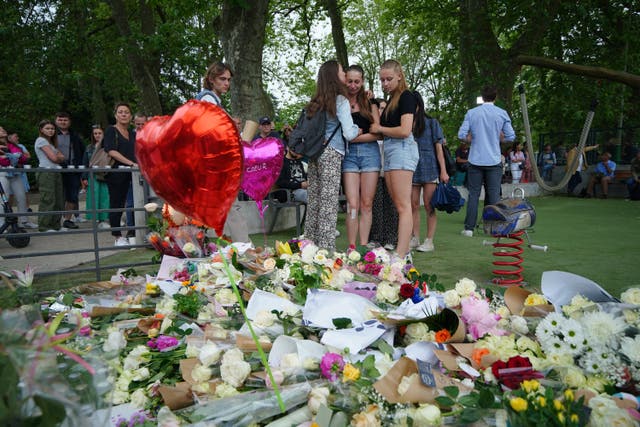 Tributes left near the scene at a lakeside park in Annecy, France, following a knife attack (Peter Byrne/PA)