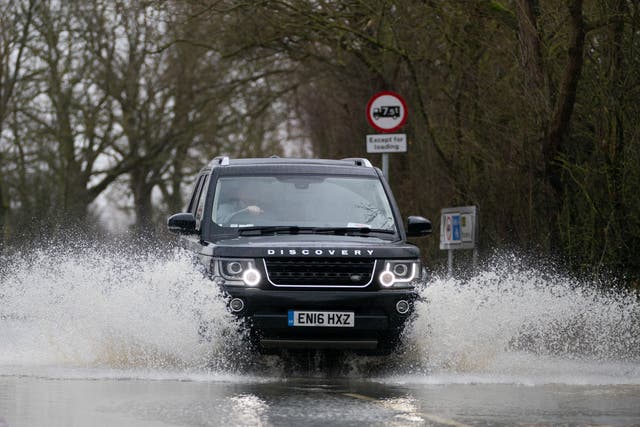 Motorists making essential journeys during expected thunderstorms are being advised to modify their driving style to stay safe (Joe Giddens/PA)
