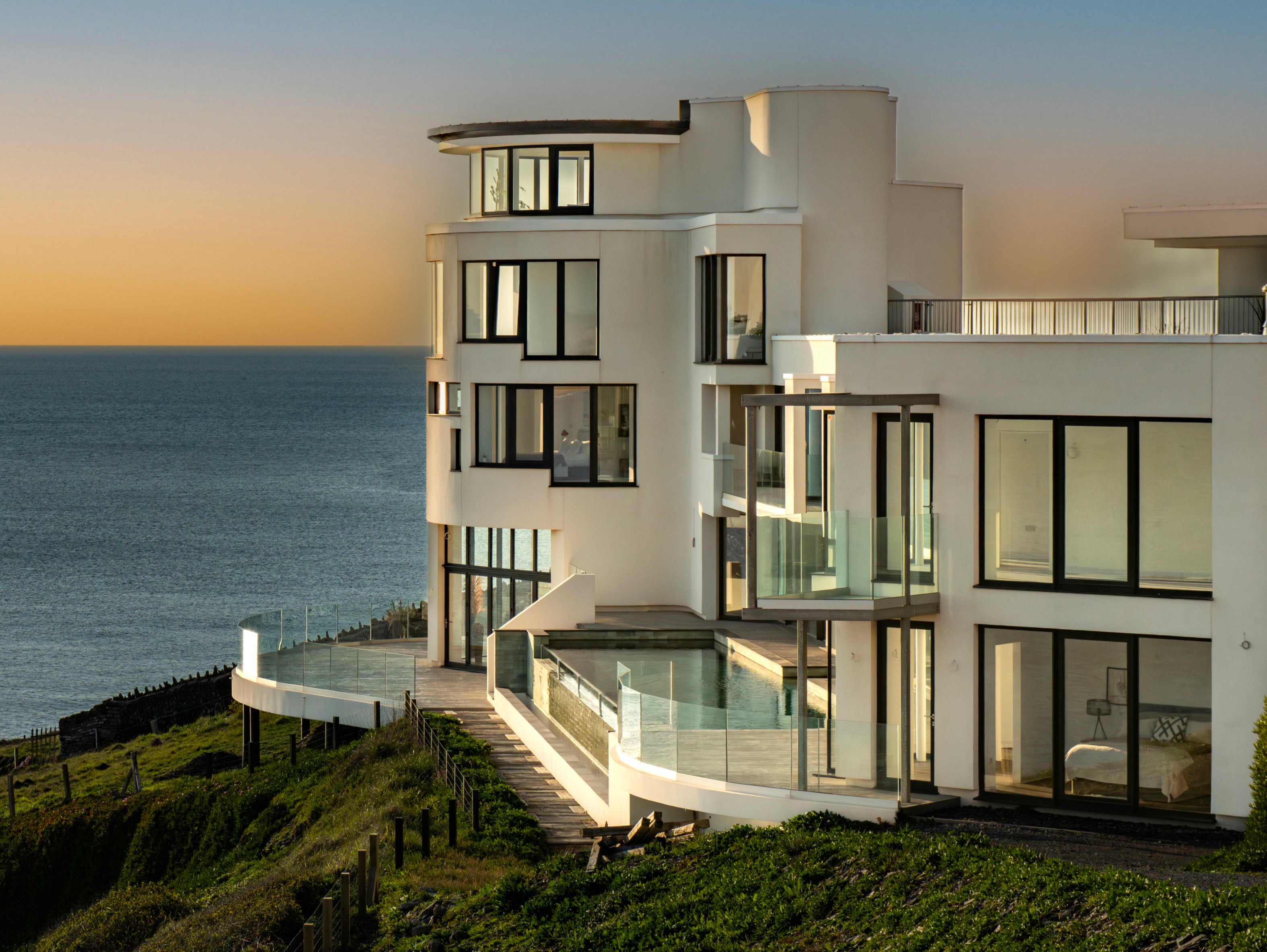 The house sits on the cliff edge