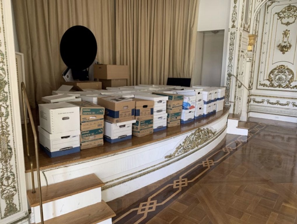 <p>Dozens of boxes were stored on a stage at the Mar-a-Lago ballroom for months </p>