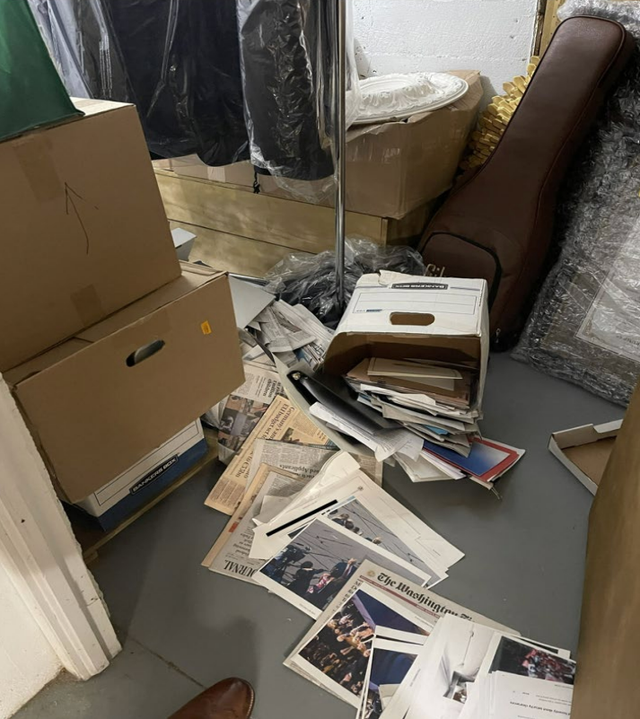 <p>A photo of classified documents spilled on the floor in a storage room was texted between staffers </p>