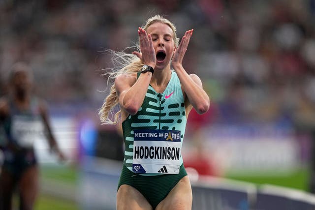 <p>Keely Hodgkinson reacts as she crosses the finish line to win the 800 metres in a new British record (Michel Euler/AP)</p>