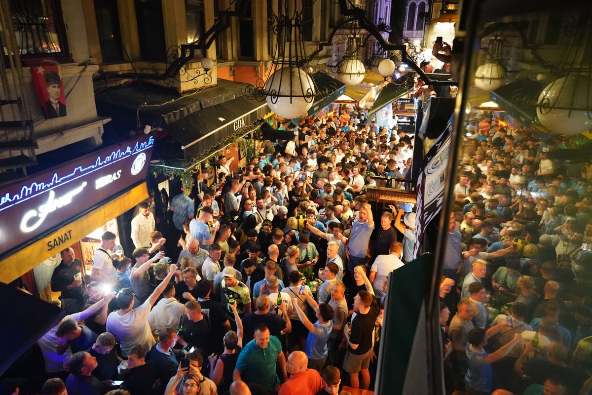 Manchester City fans take over streets of Istanbul with flares and chants