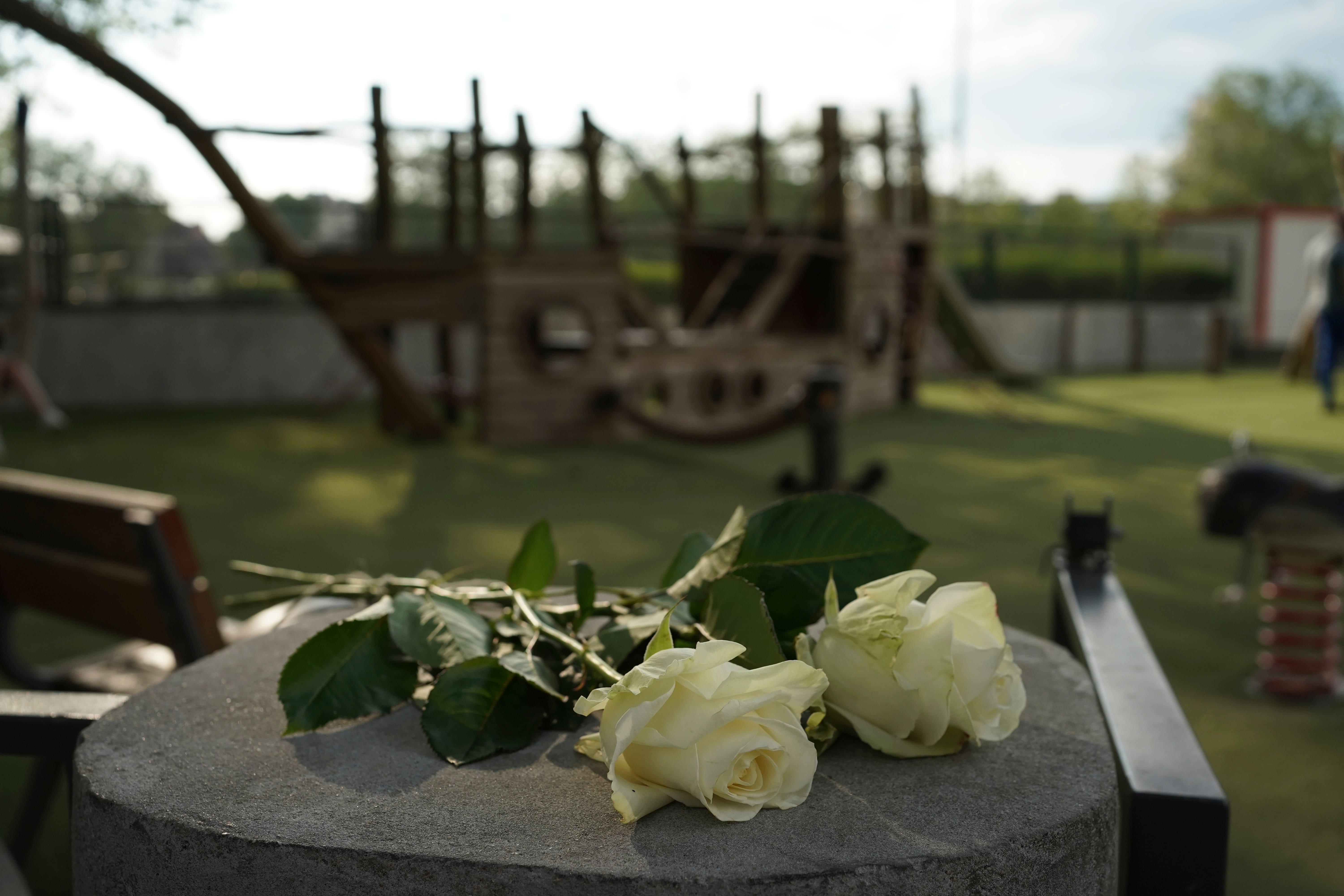 Floral tributes were left at the playground where the stabbing unfolded