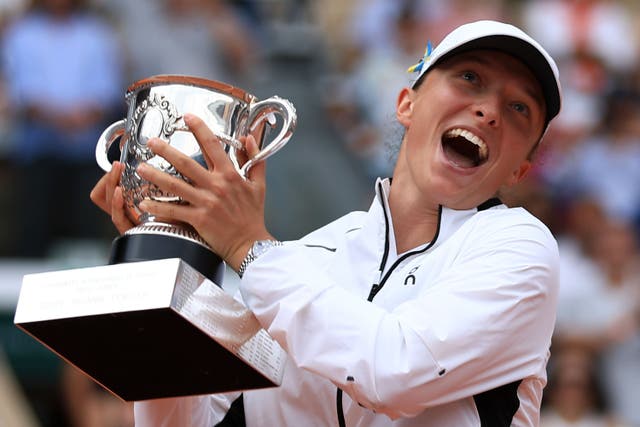 Iga Swiatek shows her delight at winning another French Open title (Aurelien Morissard/AP)