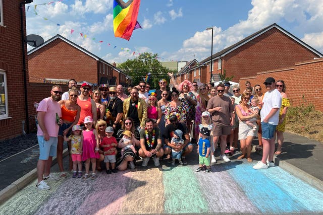 Residents of Batts Close in Rugby, Warwickshire complete their 80-metre Pride march, though to be the world’s shortest Pride (Ben Goodwin)