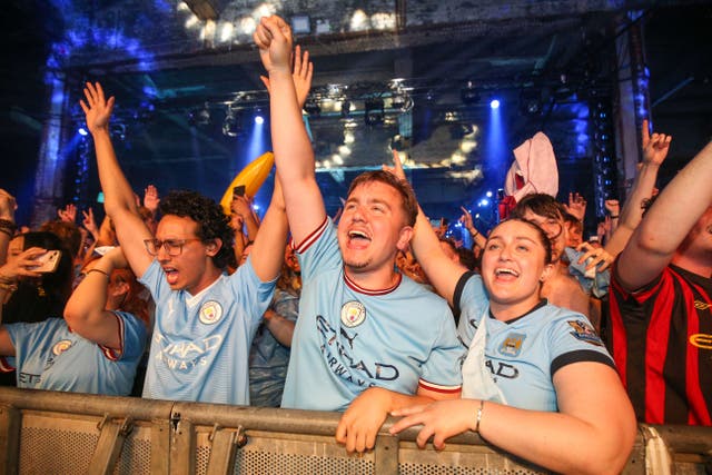 Manchester City fans celebrate full time at the Depot Mayfield in Manchester (Nigel French/PA