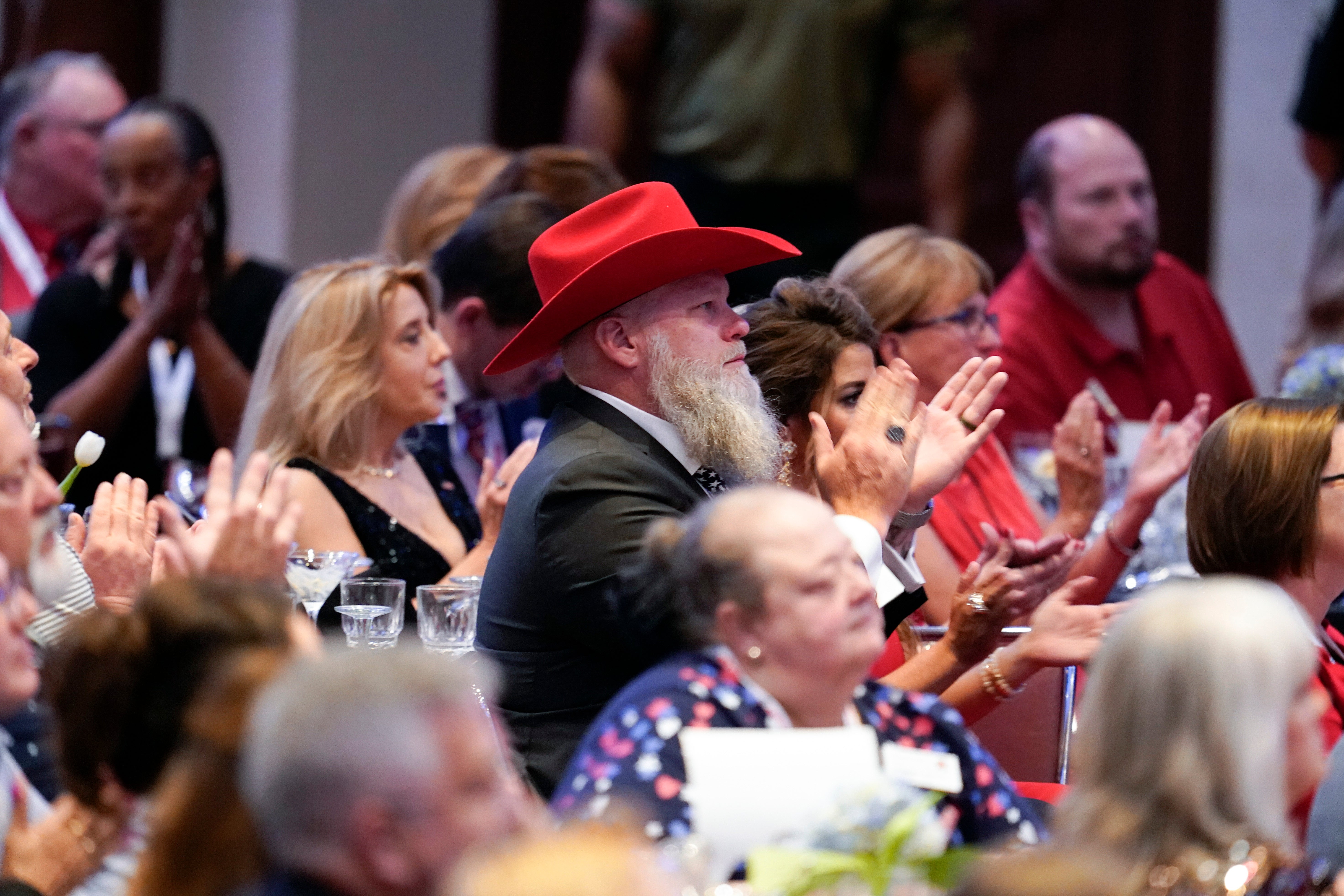 People applaud as former President Donald Trump speaks during the North Carolina Republican Party Convention in Greensboro, N.C., Saturday, June 10, 2023. (AP Photo/George Walker IV)