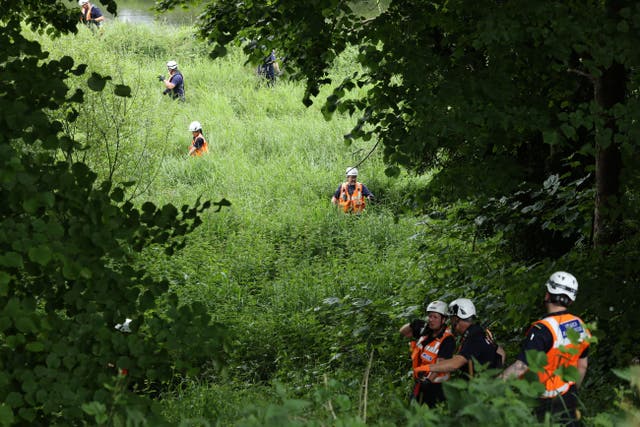 Community Rescue Service volunteers in thick undergrowth near the River Braid in Ballymena (Liam McBurney/PA)