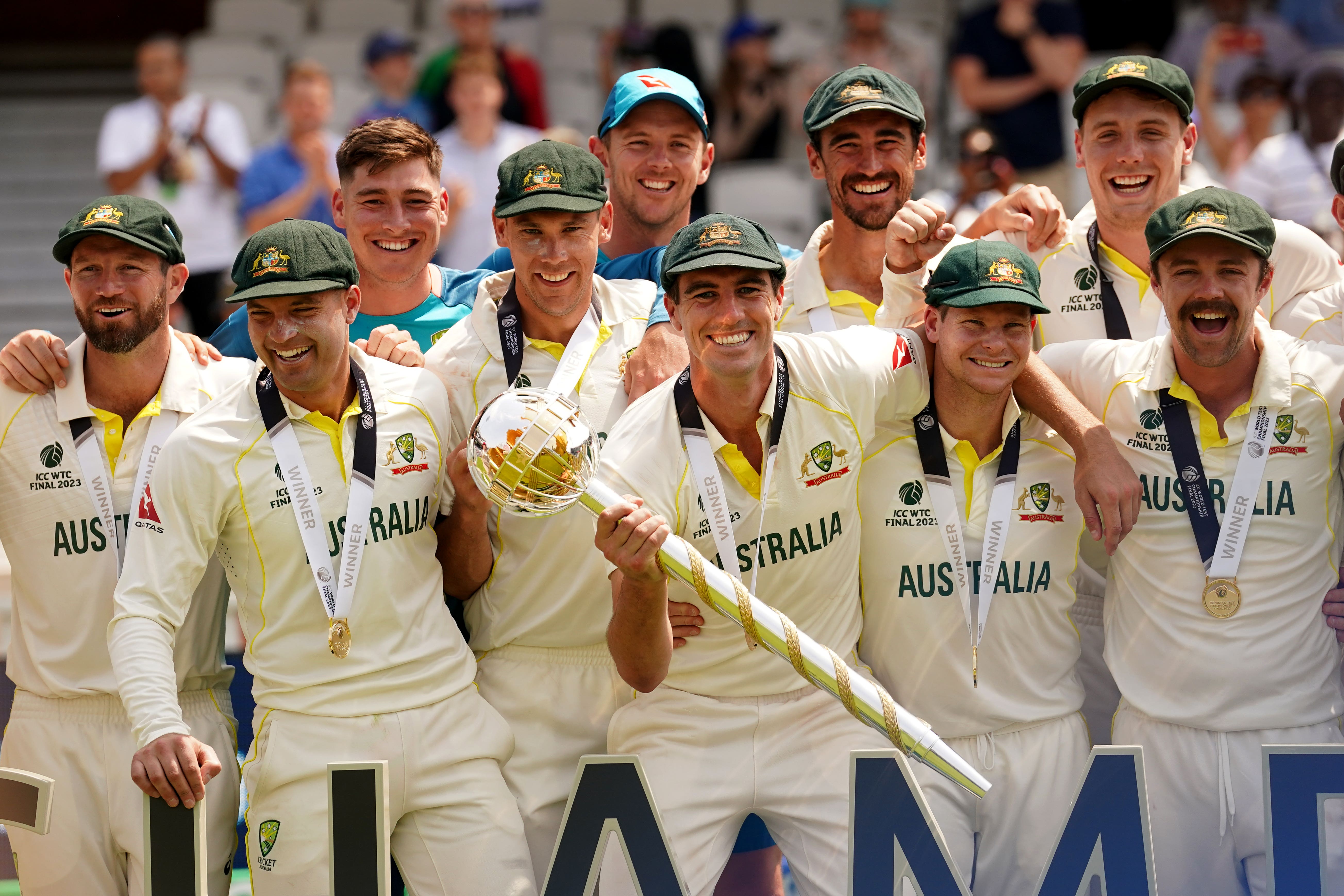 Pat Cummins and team-mates celebrate Australia’s triumph (Adam Davy/PA)
