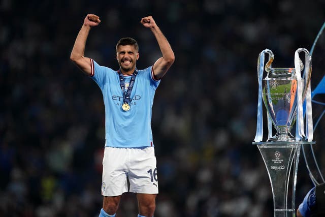 Manchester City’s Rodri celebrates with the Champions League trophy (Nick Potts/PA)