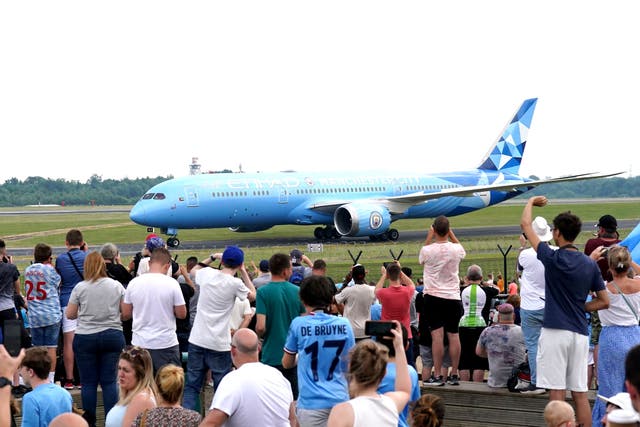 Manchester City’s players arrive at Manchester Airport after their victory (Tim Goode/PA)