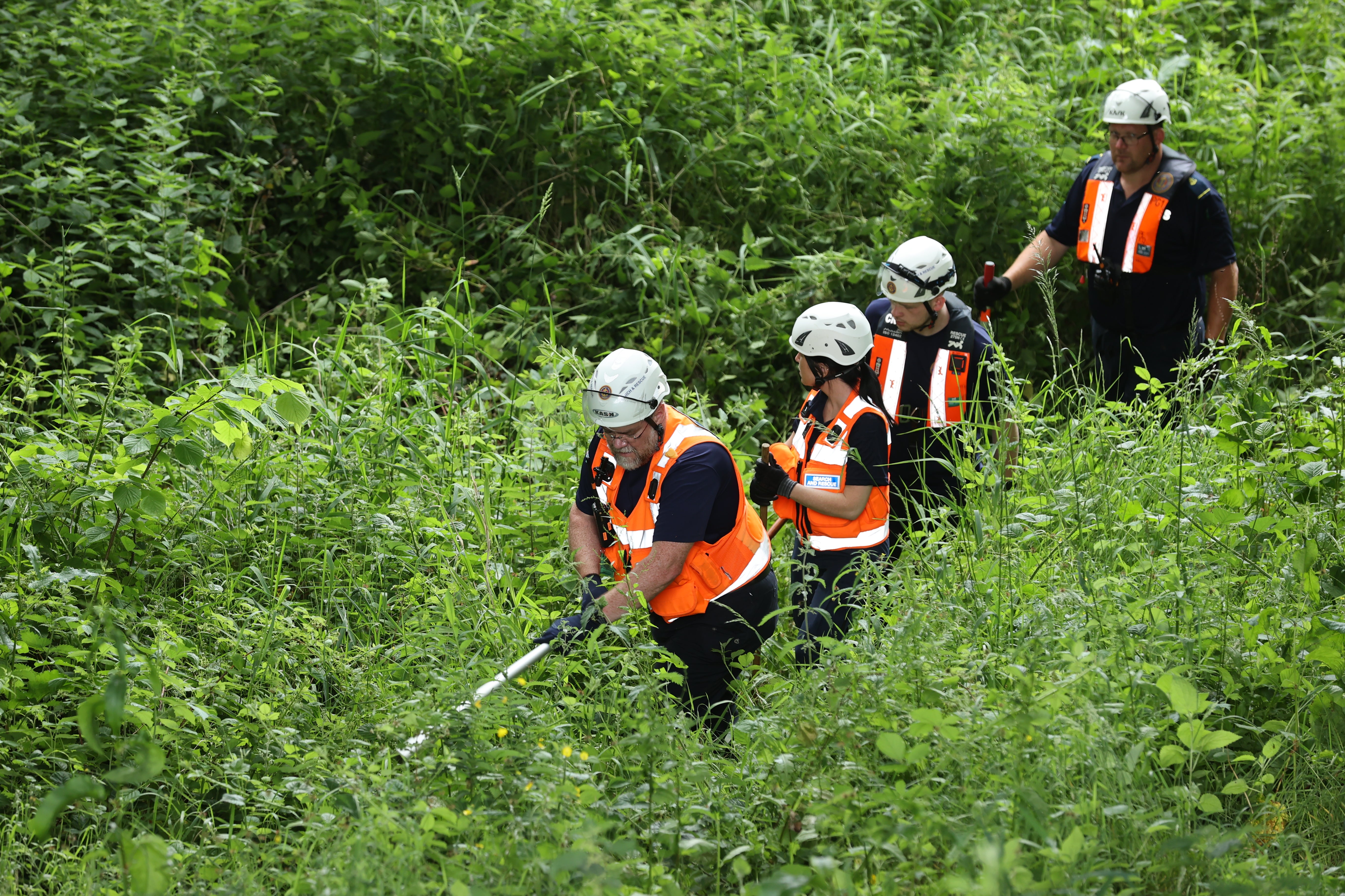 Community Rescue Service volunteers in thick undergrowth near the River Braid in Ballymena during the search for Chloe Mitchell, who was last seen on CCTV in the early hours of June 3 in Ballymena town centre, Co Antrim.