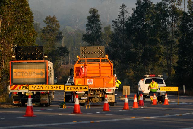 <p>Emergency workers man a roadblock near the town of Greta following a bus crash in the Hunter Valley, north of Sydney, Australia</p>