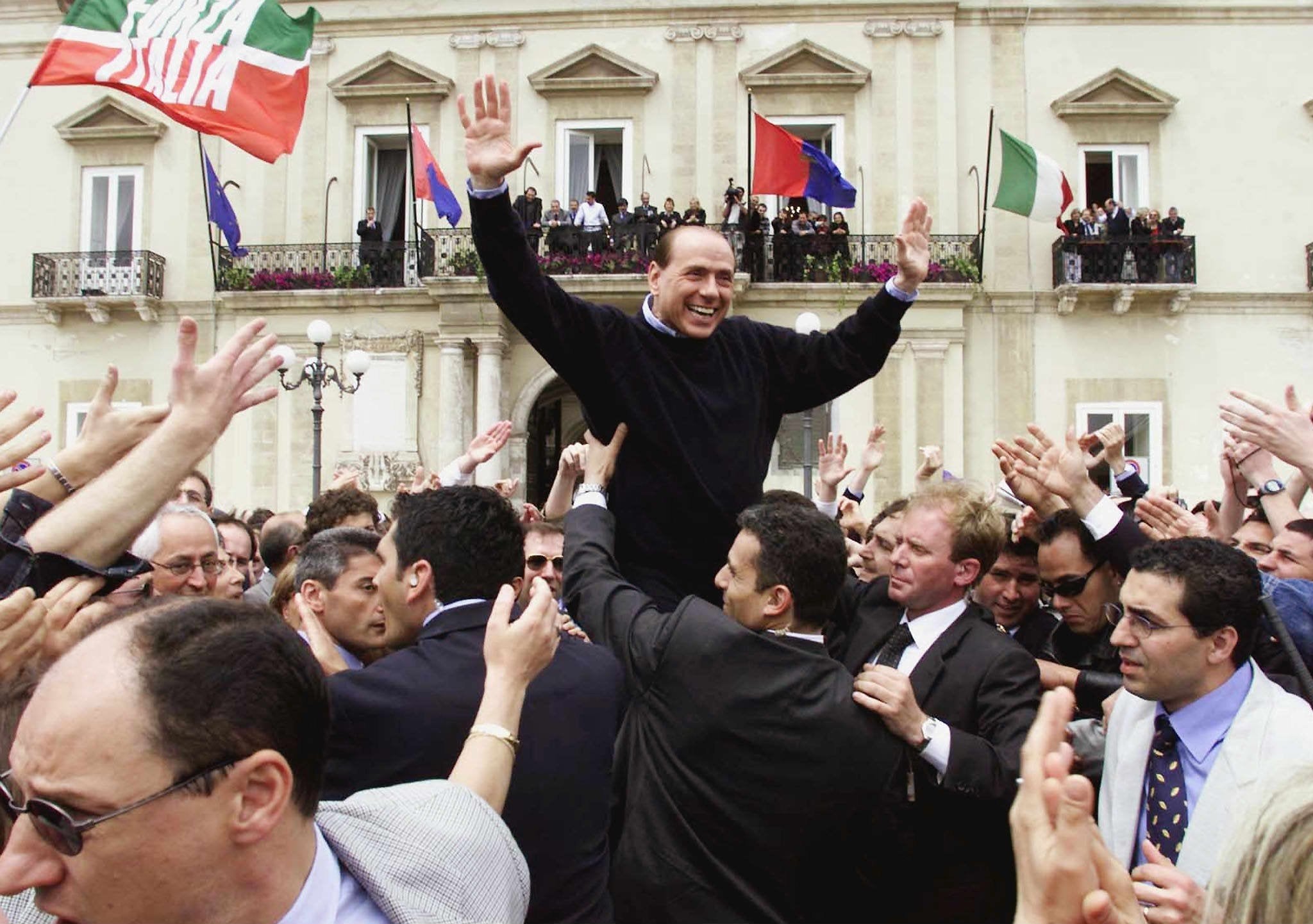 Silvio Berlusconi is carried by his supporters during an election rally in Taranto on Saturday 5 May 2001