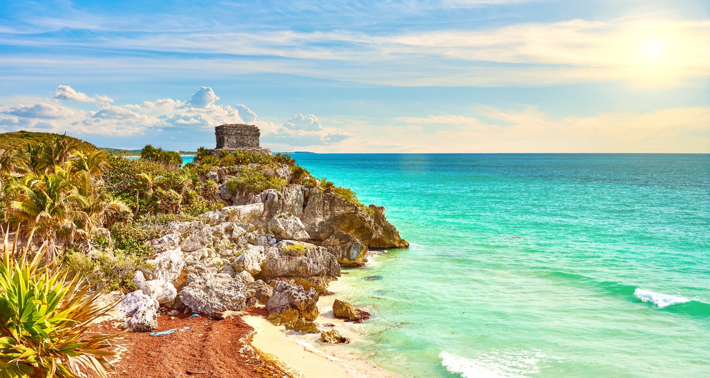 Tulum is characterised by rugged coastal cliffs and inland cenotes