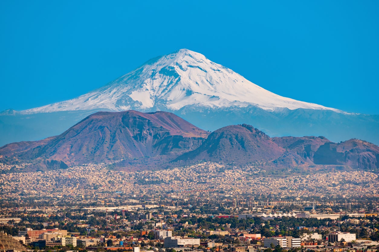The Popocatepetl volcano provides a dramatic backdrop for the Mexican capital