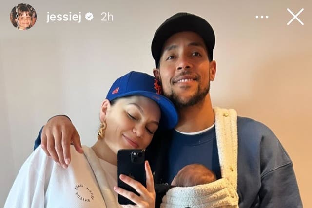 <p>Jessie J and partner Chanan Safir Colman pose in front of a mirror with their newborn son, Sky</p>