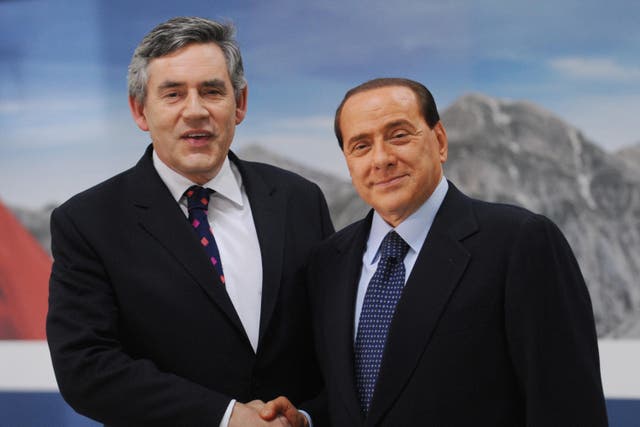 Former prime minister Gordon Brown with Silvio Berlusconi (PA)