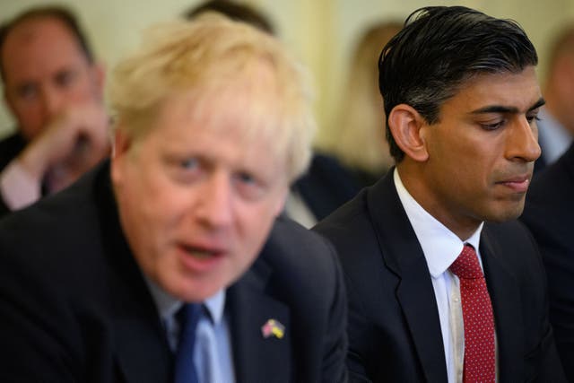 Rishi Sunak has dug into the Tory civil war by accusing Boris Johnson of asking him to take action that “wasn’t right” in discussions over the former prime minister’s honours list (Leon Neal/PA)