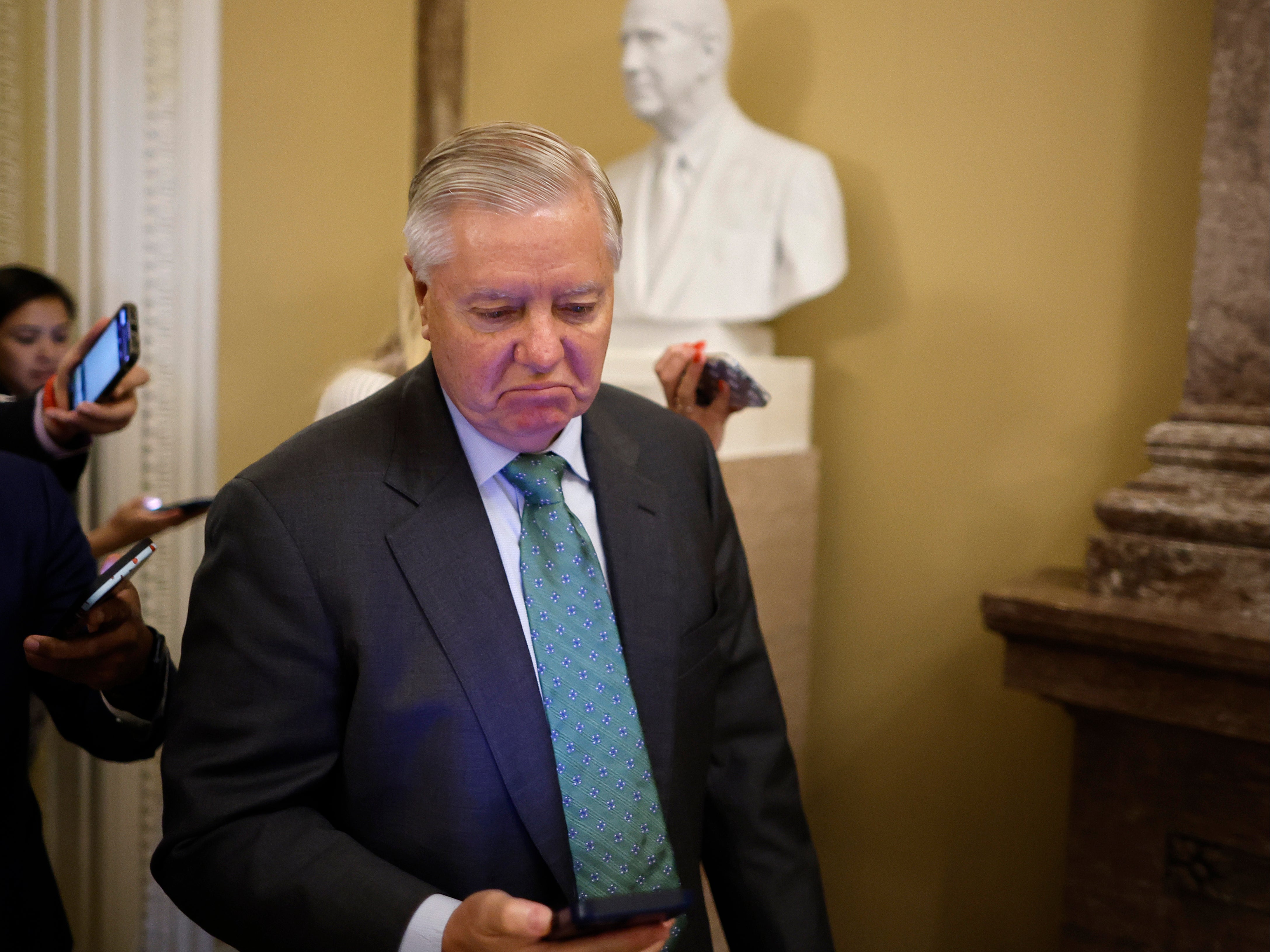 Sen. Lindsey Graham (R-SC) talks with reporters in between votes at the US Capitol