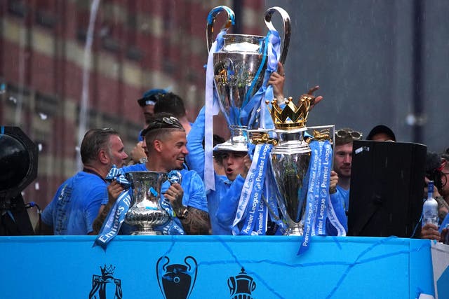 City celebrated their treble with an open-top bus parade in Manchester (Peter Byrne/PA)