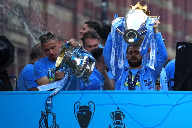 Manchester City’s Bernardo Silva lifts the Premier League trophy during the parade (Peter Byrne/PA)