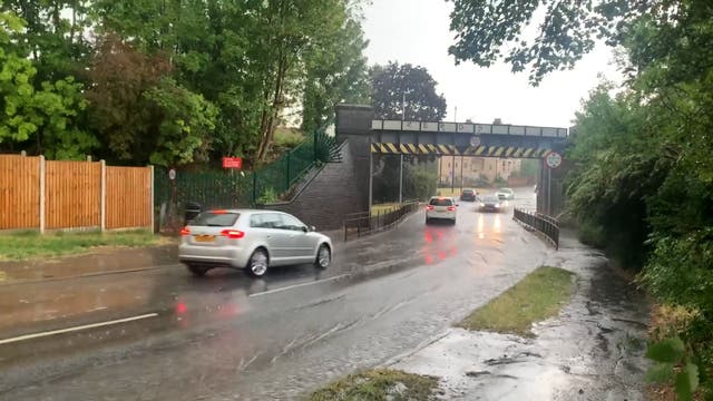 <p>Maidenhead street flooded as thunderstorms hit England </p>
