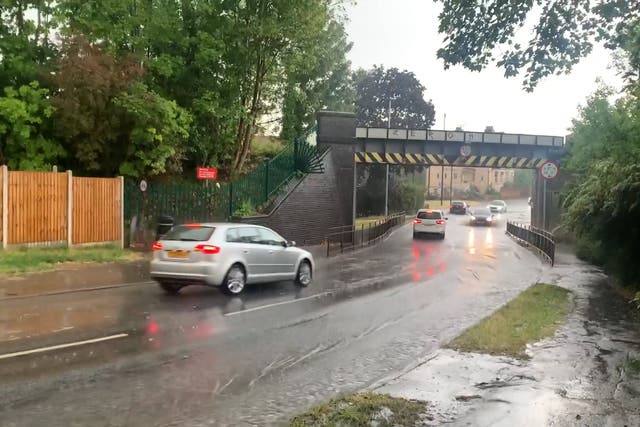 <p>Maidenhead street flooded as thunderstorms hit England </p>
