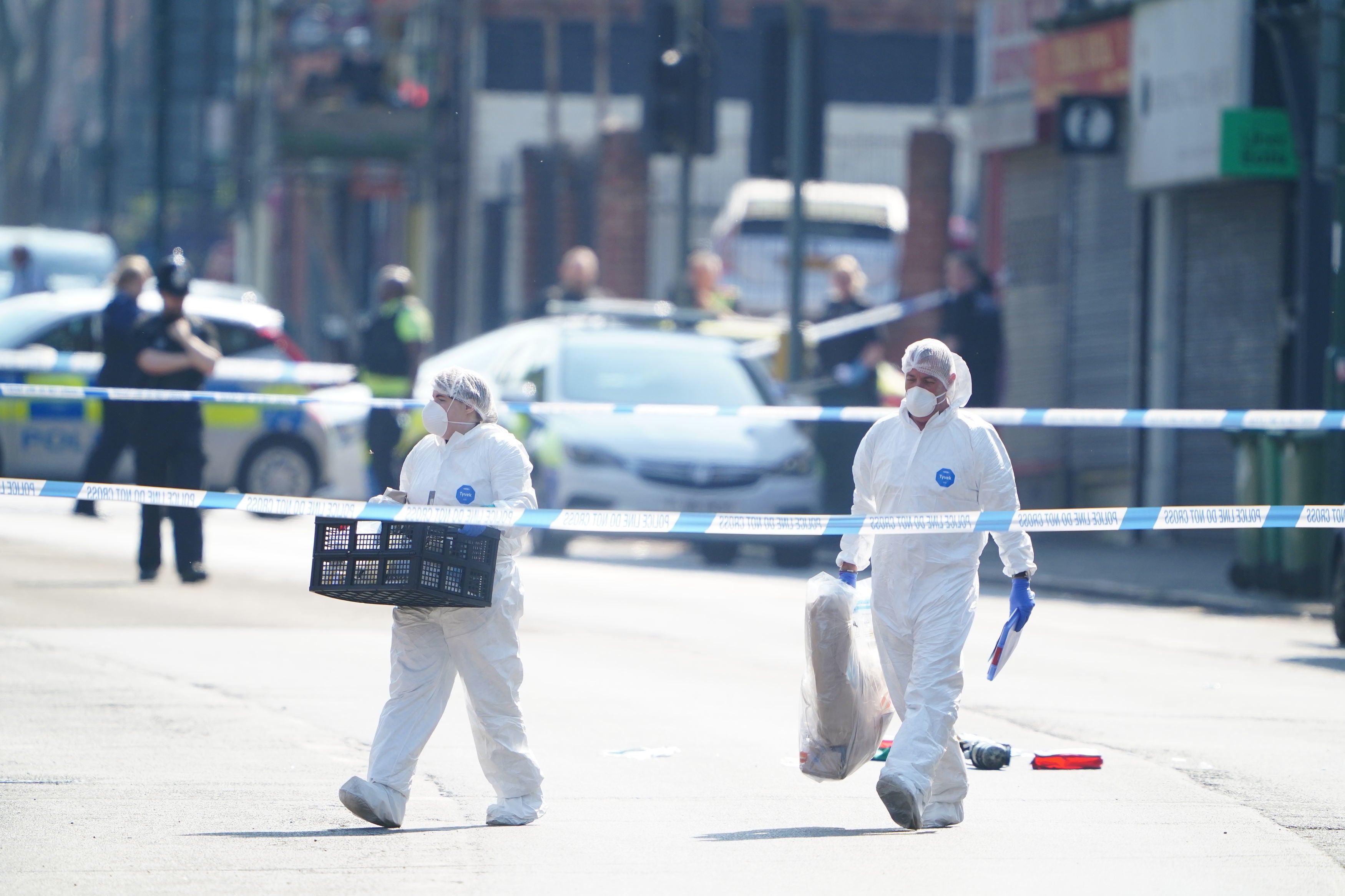 Police forensics officers on Ilkeston Road after three people were killed in Nottingham city centre