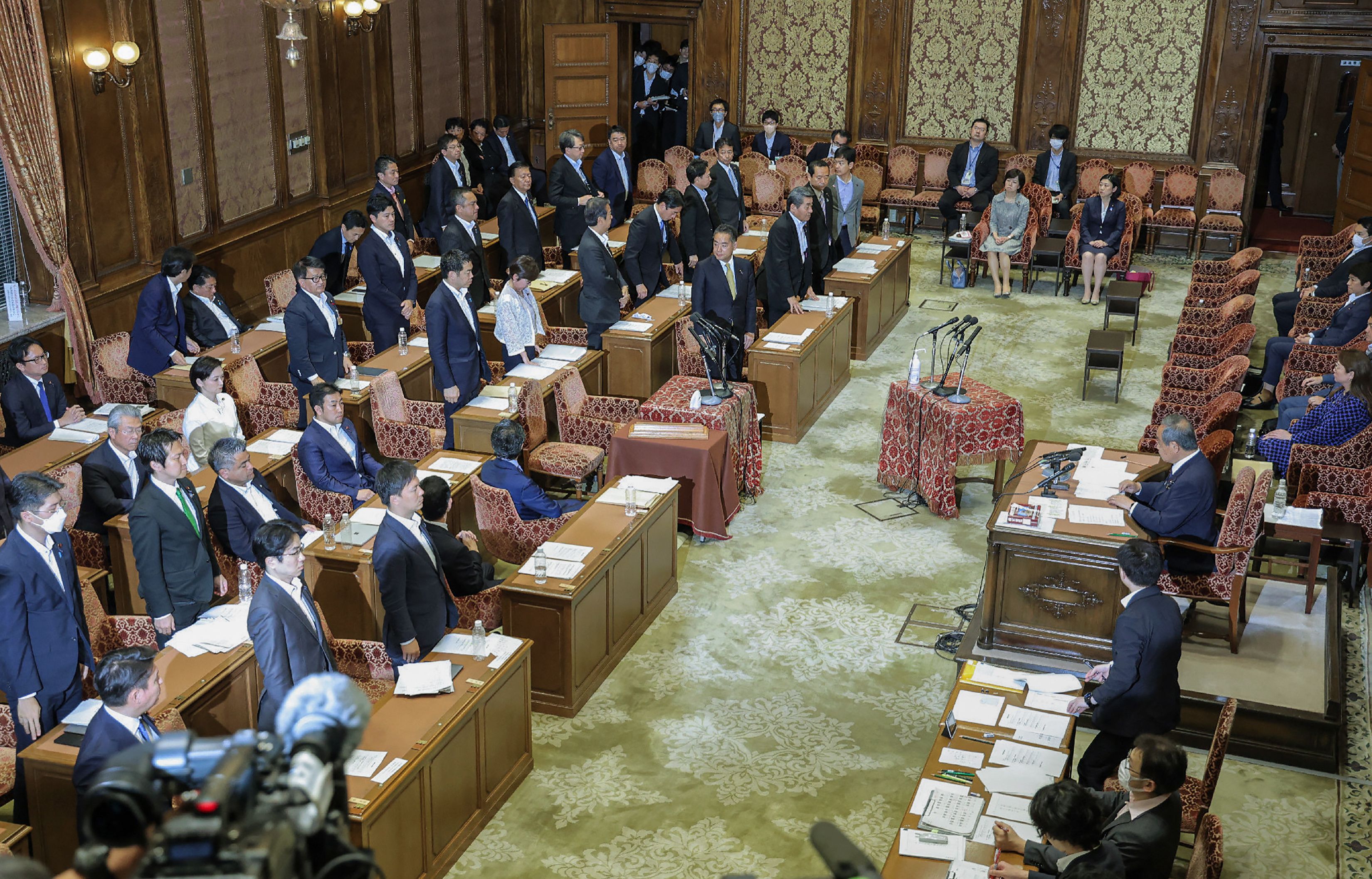 Members of the House of Representatives cabinet committee stand as they vote in favour of the ruling party’s amendment to a bill to promote the understanding of LGBT and other sexual minorities, at the parliament building in Tokyo on 9 June 2023