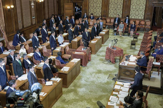 <p>Members of the House of Representatives cabinet committee stand as they vote in favour of the ruling party’s amendment to a bill to promote the understanding of LGBT and other sexual minorities, at the parliament building in Tokyo on 9 June 2023</p>
