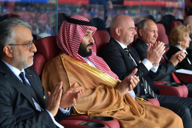 <p>Prince Mohammed Bin Salman with Fifa president Gianni Infantino and Russia’s President Vladimir Putin at the 2018 World Cup </p>