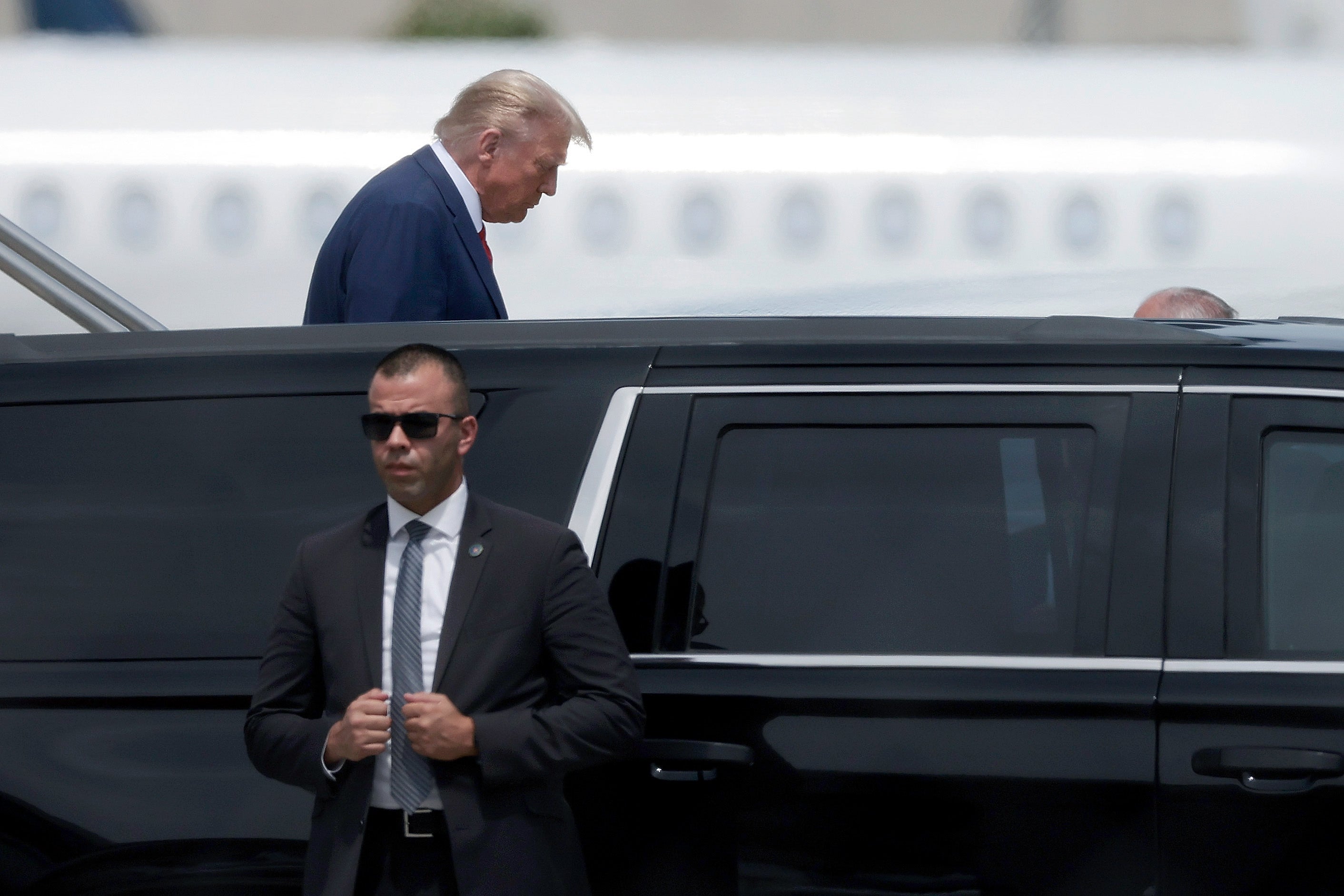 Republican presidential candidate former US President Donald Trump arrives at the Miami International ahead of his arraignment on federal charges
