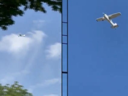 <p>Michael Arnold’s plane is seen flying low over Schuylerville, New York</p>
