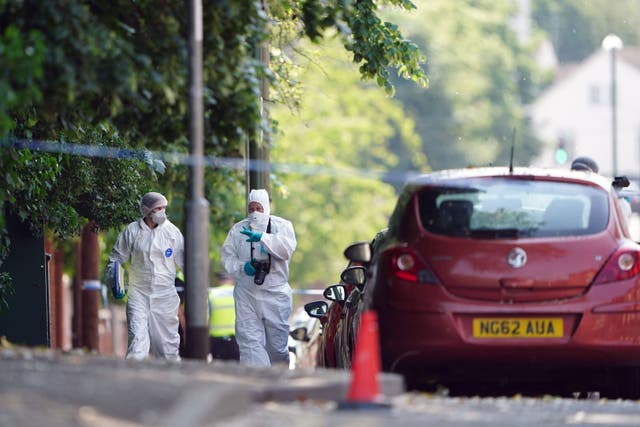 Police forensics officers on Bentinck Road in Nottingham (Zac Goodwin/PA)