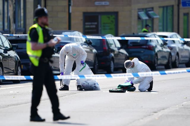 Police forensics officers on Ilkeston Road, Nottingham, as a 31-year-old man has been arrested on suspicion of murder after three people were killed in Nottingham city centre early on Tuesday morning. Picture date: Tuesday June 13, 2023.