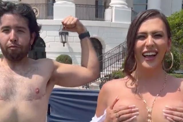 <p>Trans model Rose Montoya, right, poses semi-topless at a White House Pride month event with a transmasculine activist, left, who underwent top surgery</p>
